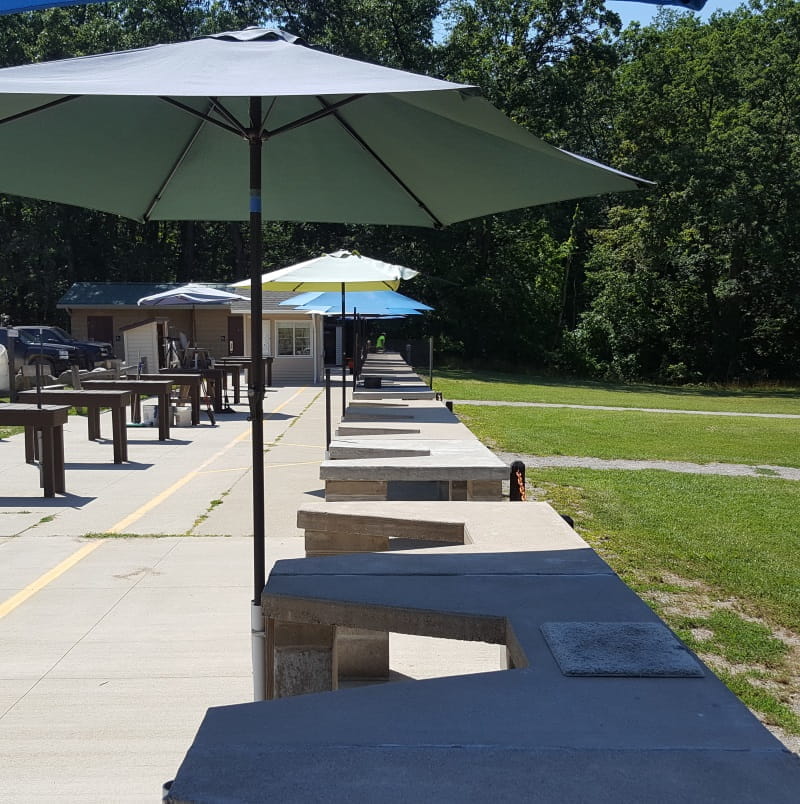 Ortonville shooting range shooting stations with umbrellas for shade