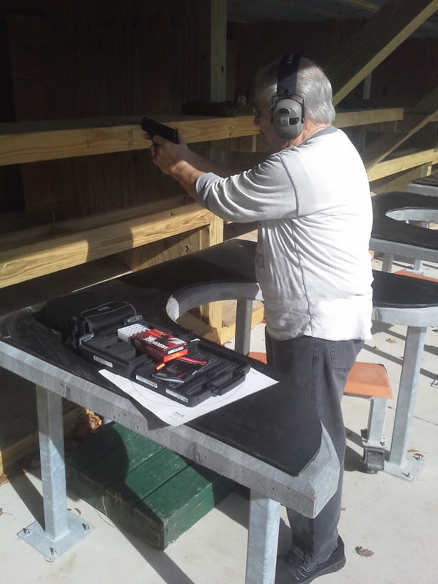 Man shooting at Pontiac Lake Shooting Range handgun range 
