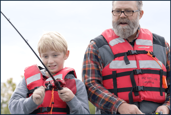 Video thumbnail with man and son fishing together on a boat
