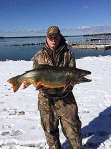 angler holding a splake caught at Hessel