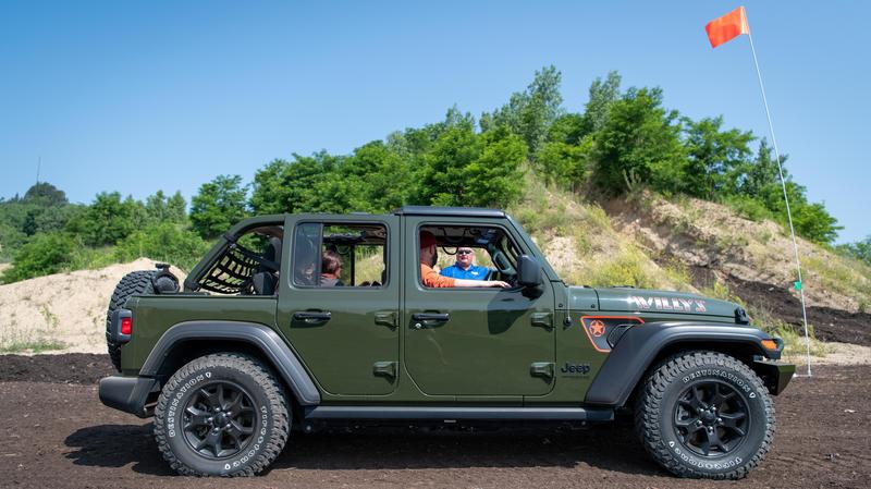 A Jeep at an ORV scramble area with an orange flag
