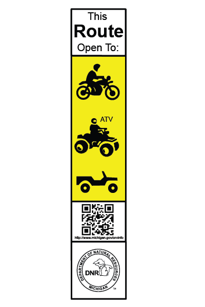 A white and yellow rectangular sign with a motorcycle, ATV and ORV indicating an ORV route open to all ORV types