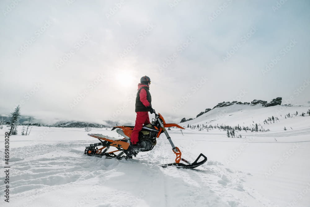 A person on a snowbike