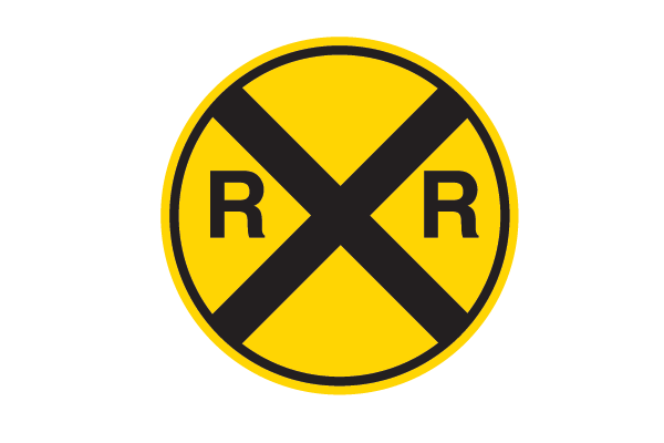 Yellow circle sign with black X in the middle and R and R text signifying railroad crossing ahead