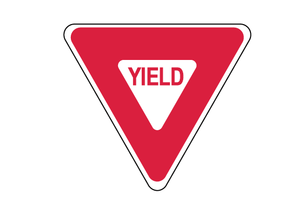 Red triangle sign with white triangle inside and red text that reads "YIELD"
