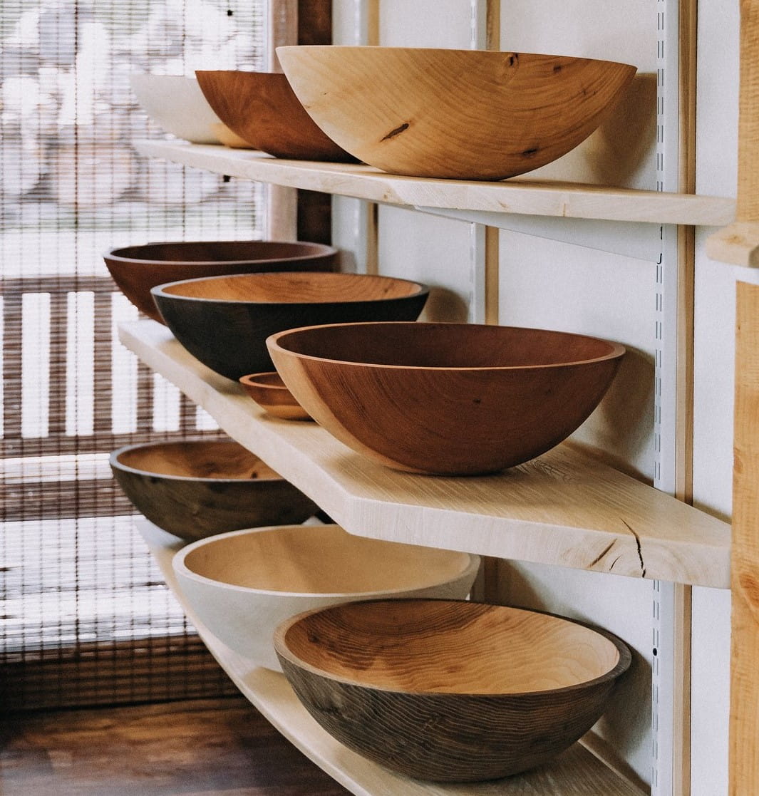 Handmade wooden bowls on a shelf