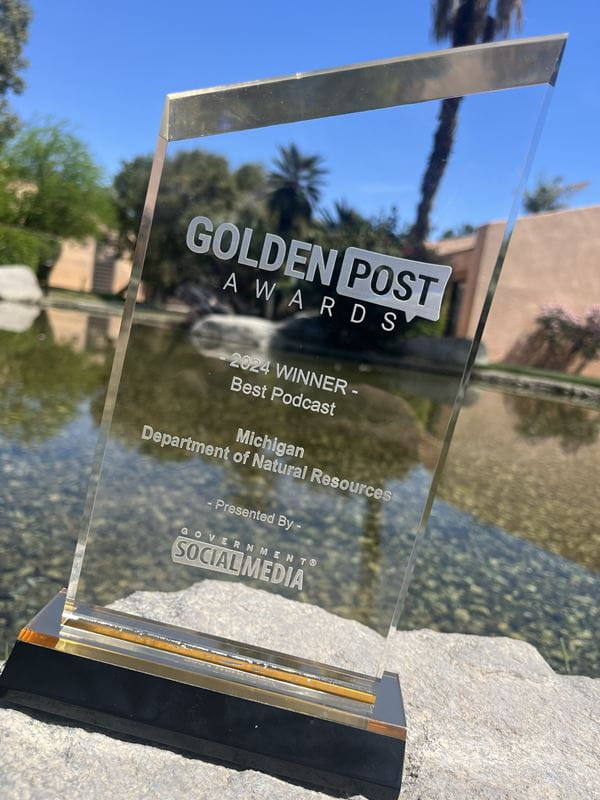 Photo of the DNR's 2024 Golden Post Award for best podcast.
