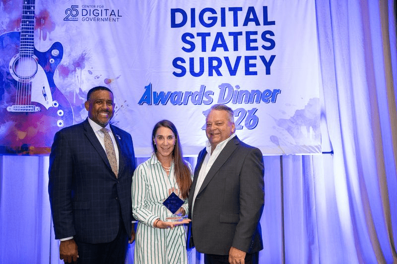 DTMB was awarded an A rating on the 2026 Digital States Survey by the Center for Digital Government. Pictured left to right with the award during an event held Sept. 27 in San Diego are Acting DTMB Director Kyle Guerrant, Agency Services Director Heather Frick, and State Chief Information Officer and Director of the Center for Shared Solutions Eric Swanson.