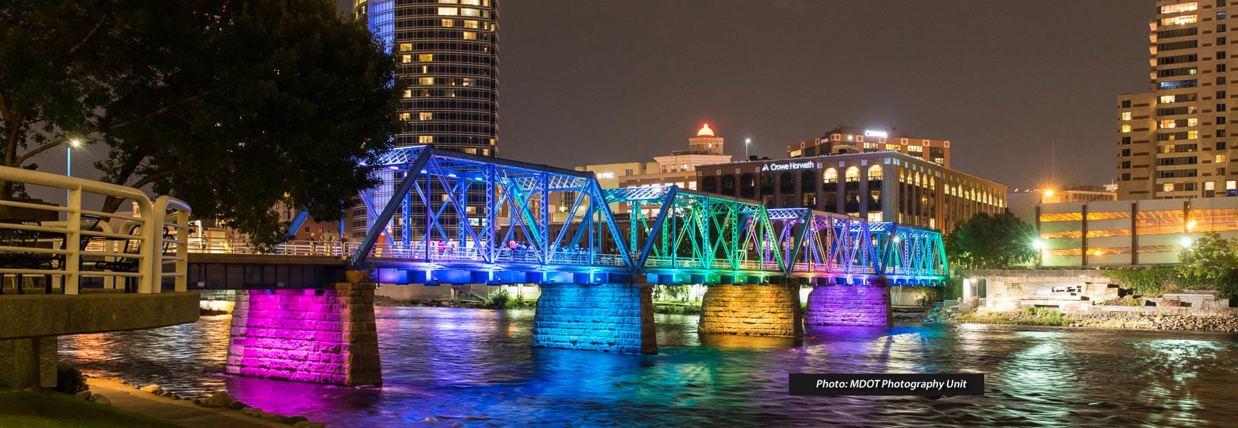 View of bridge with different colored spotlights on it