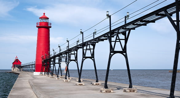 Landscape of the Grand Haven Lighthouse, pier, and catwalk, Lake Michigan, Michigan, USA
