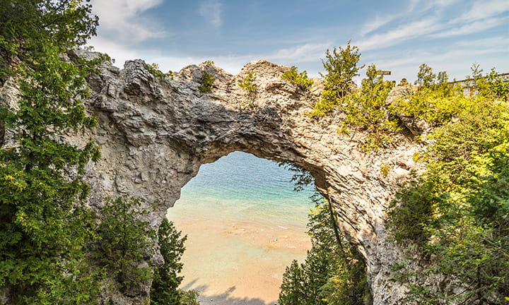 Photograph of Arch Rock on Mackinac Island with Lake Huron in the background.