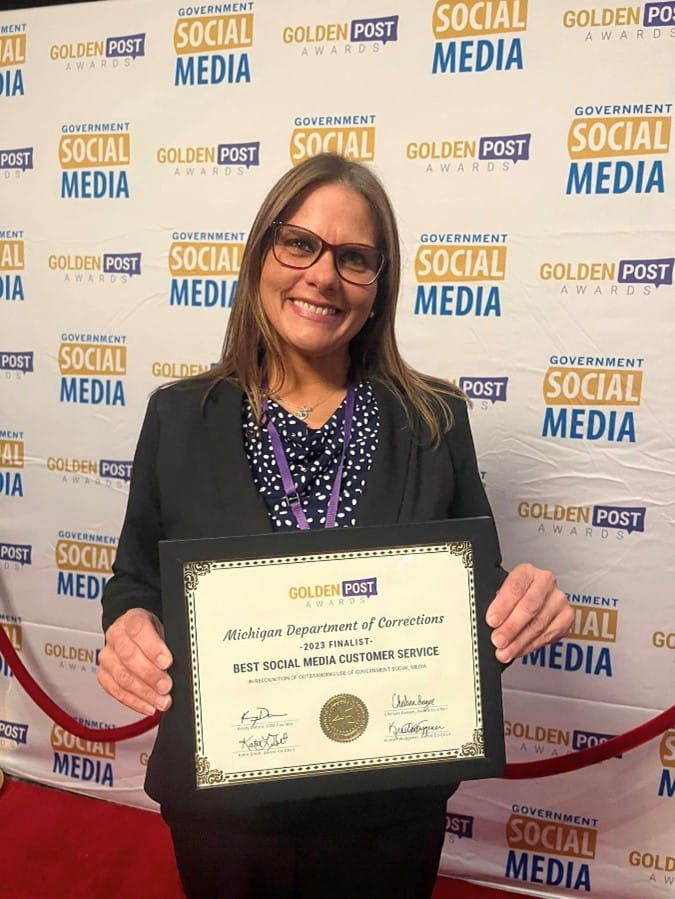 Lisa Gass, communications representative and social media strategist with MDOC, poses with the 2023 Golden Post Finalist certificate at the Government Social Media Conference in Reno-Tahoe, Nevada, May 3.