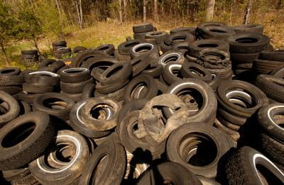a pile of tires in the woods