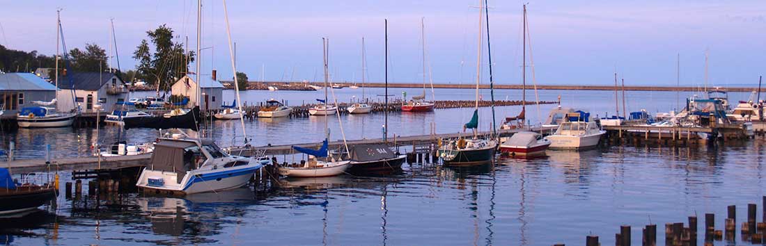 boats lined up at a dock at a Lake Superior harbor