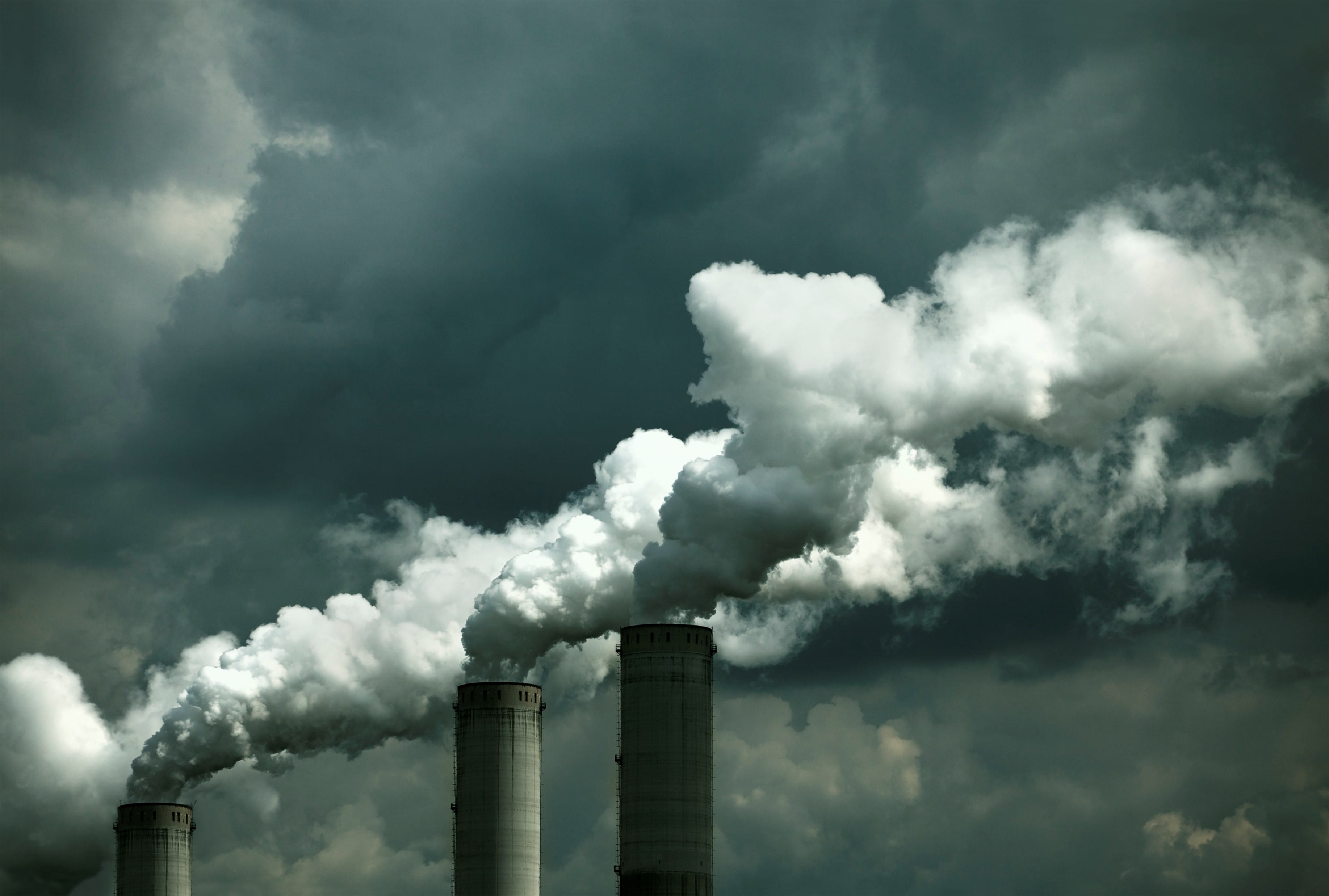 smoke stacks emitting plumes