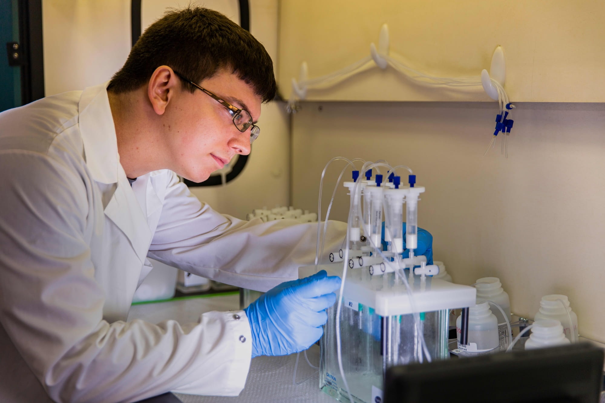 a male chemist working in a lab