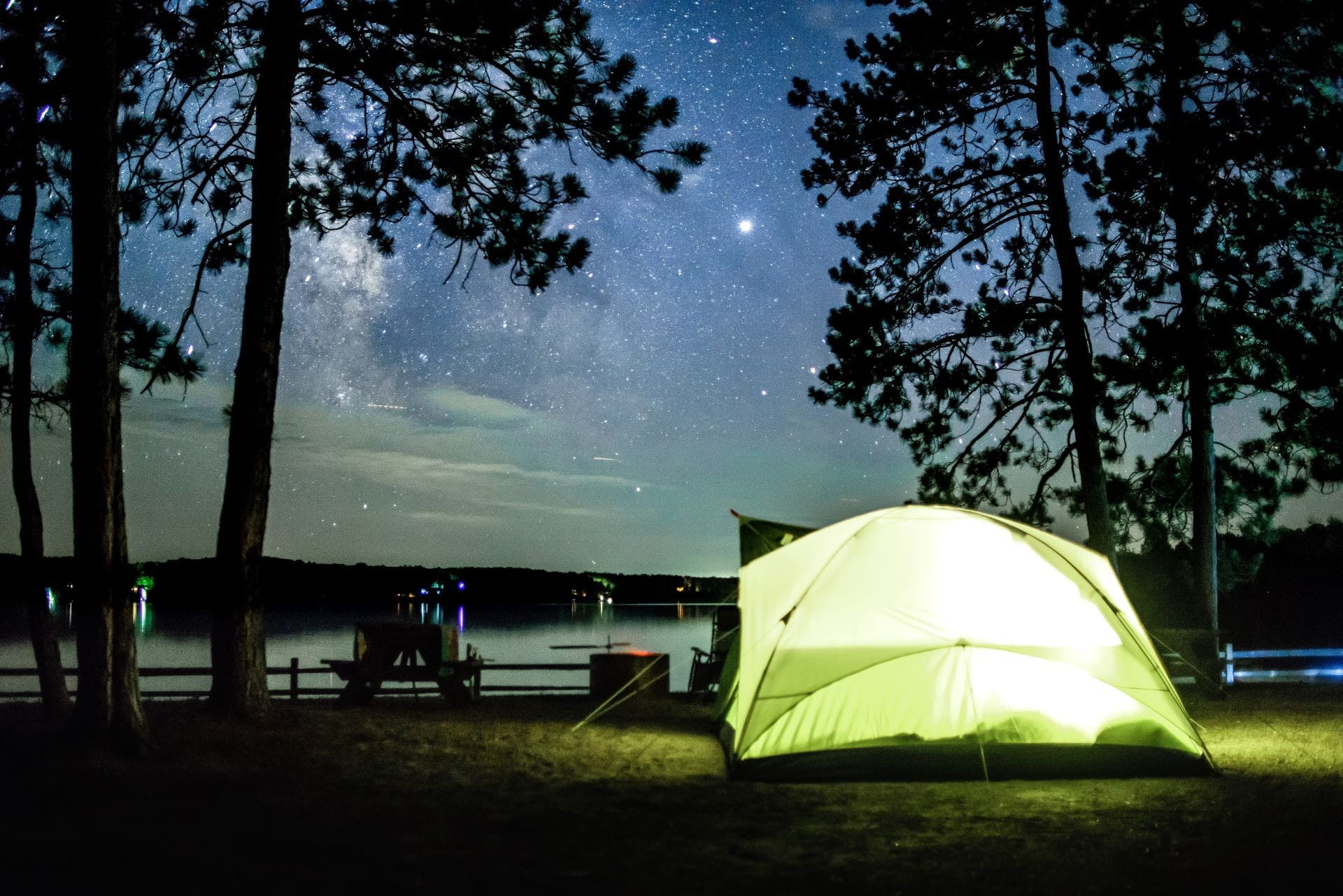 Tent lit up at night at campground at Big Bear lake Credit: DNR