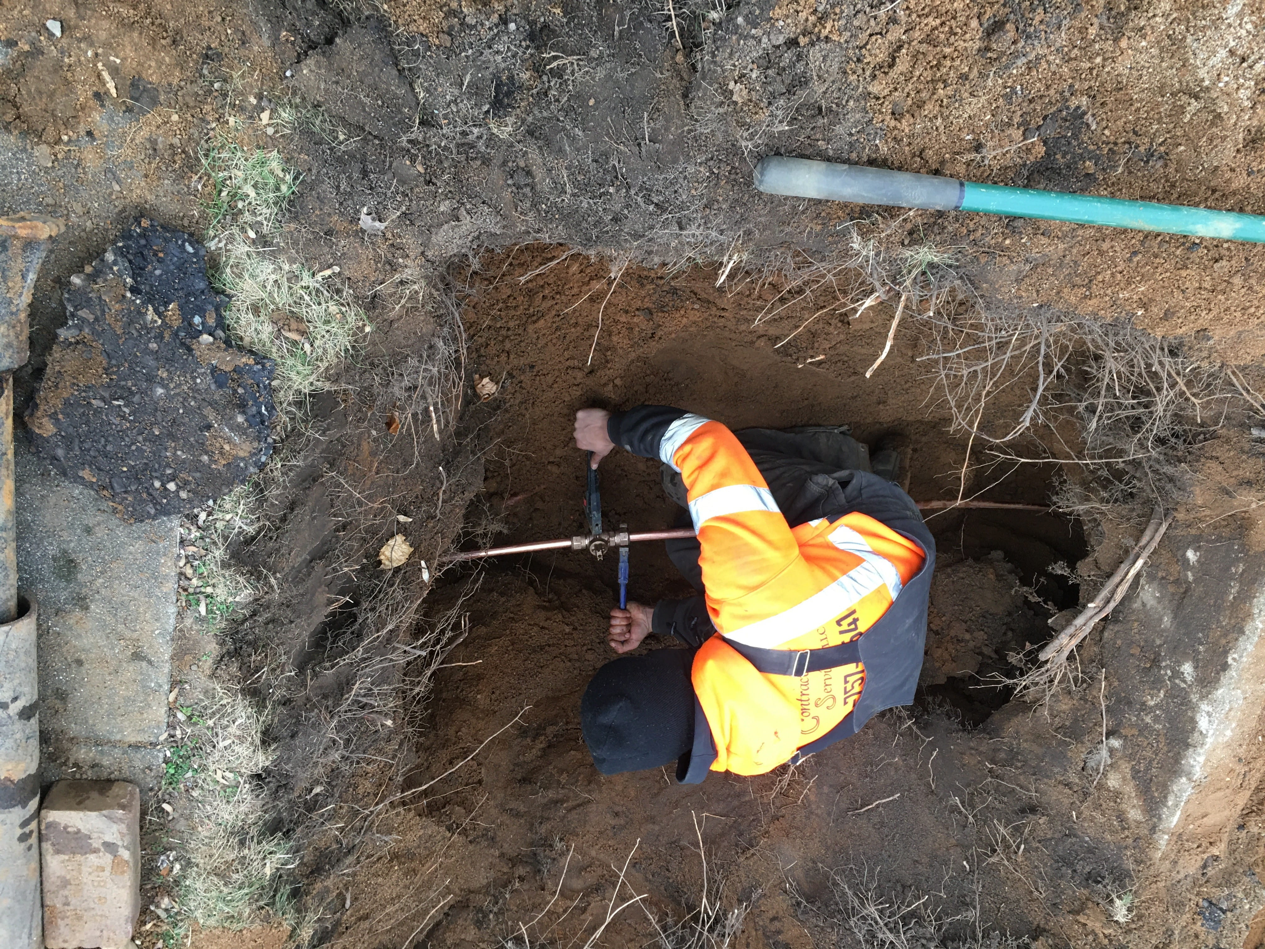 Contractor connecting new non-lead service line to a home in Benton Harbor. Courtesy Abonmarche Consulting.