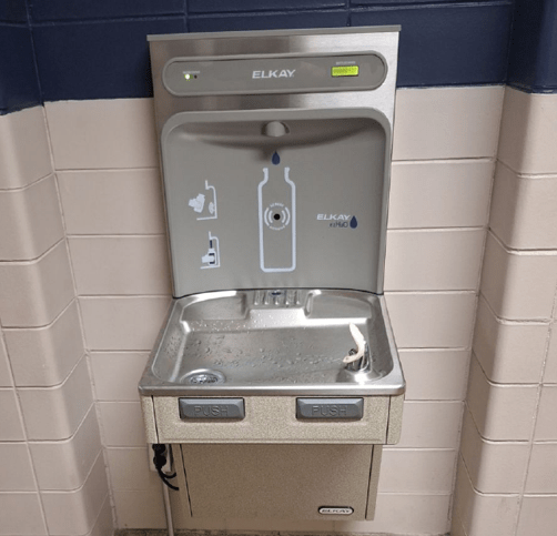 Filtered water bottle filling station in a school.