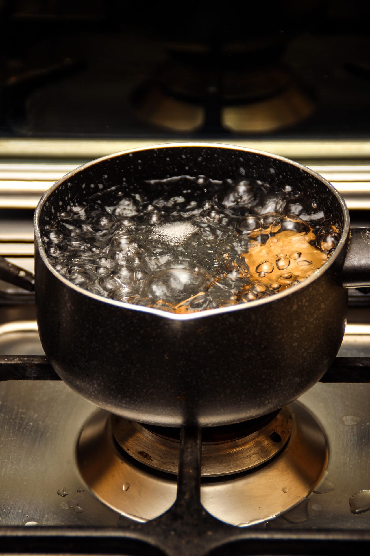 boiling water in a pan on the stove