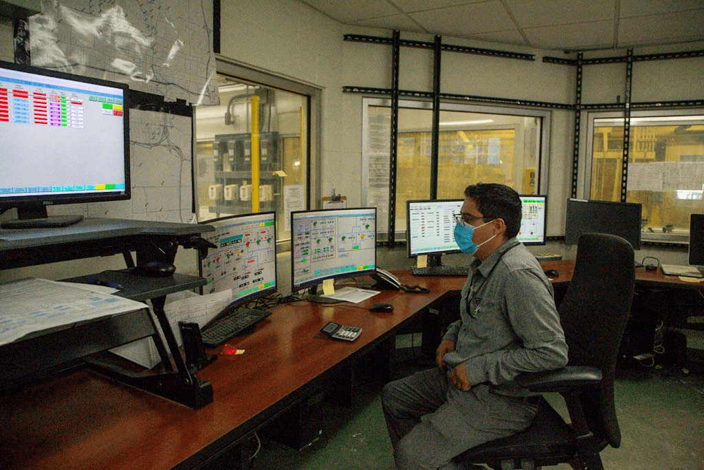 drinking water operator in a room of computers