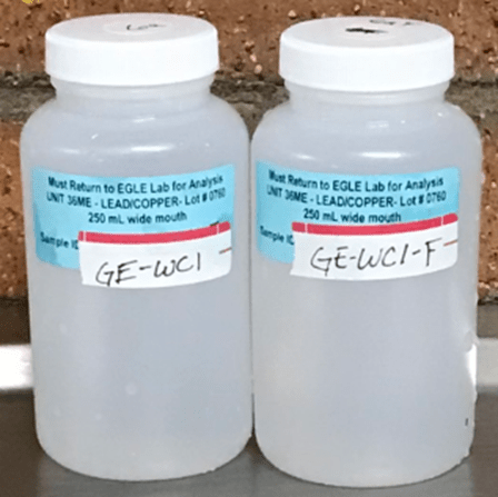 two lead sampling bottles
