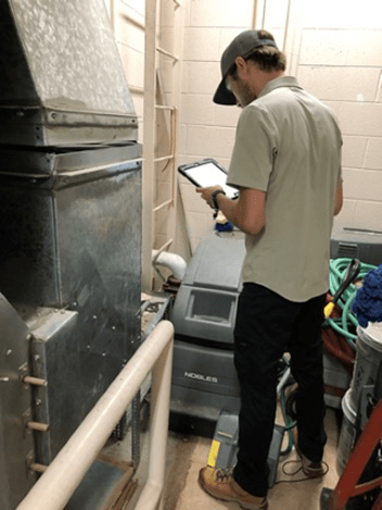 man performing a plumbing assessment
