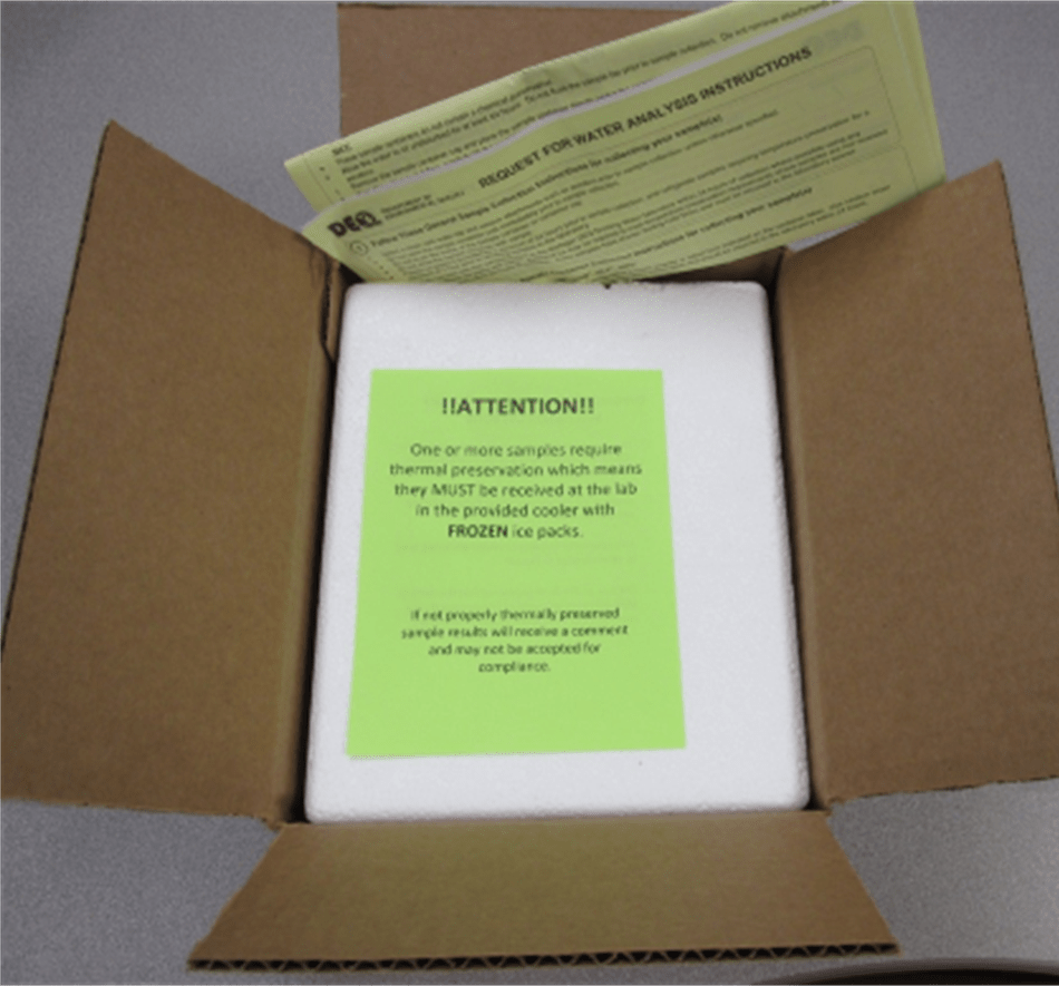 cardboard box cooler with drinking water samples inside