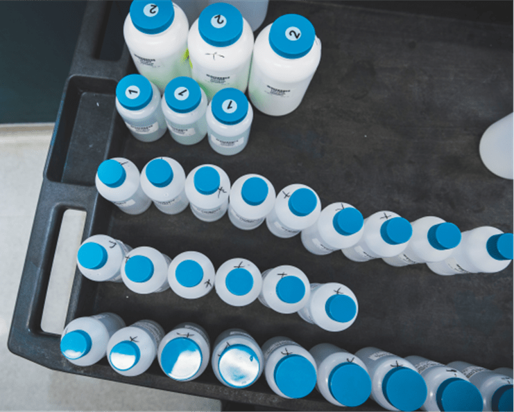 several water quality parameter sample bottles