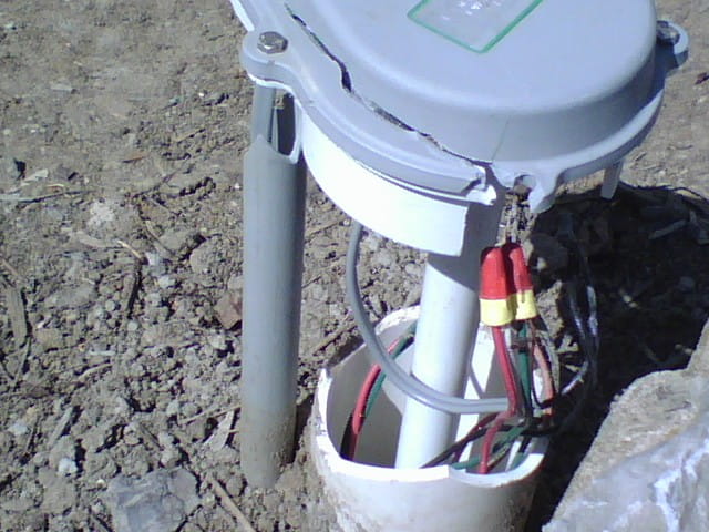 wires sticking out of a water well