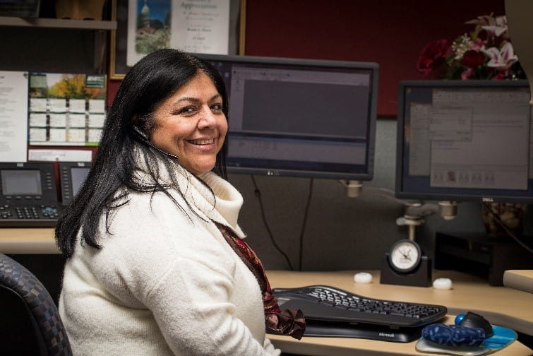 Benita Flores Environmental Assistance Center operator takes a call
