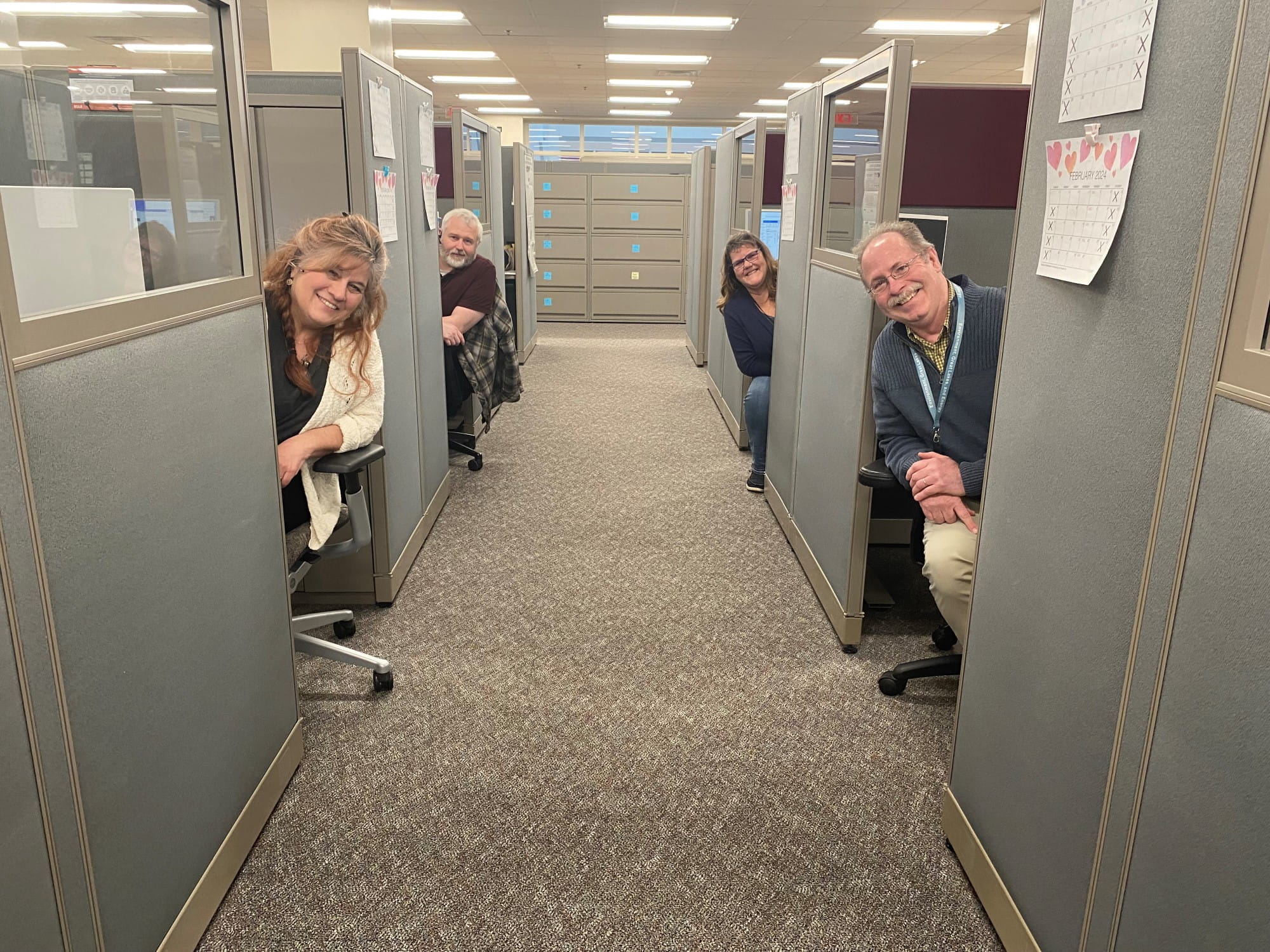 Four staffers at EGLE's Environmental Assistance Center.