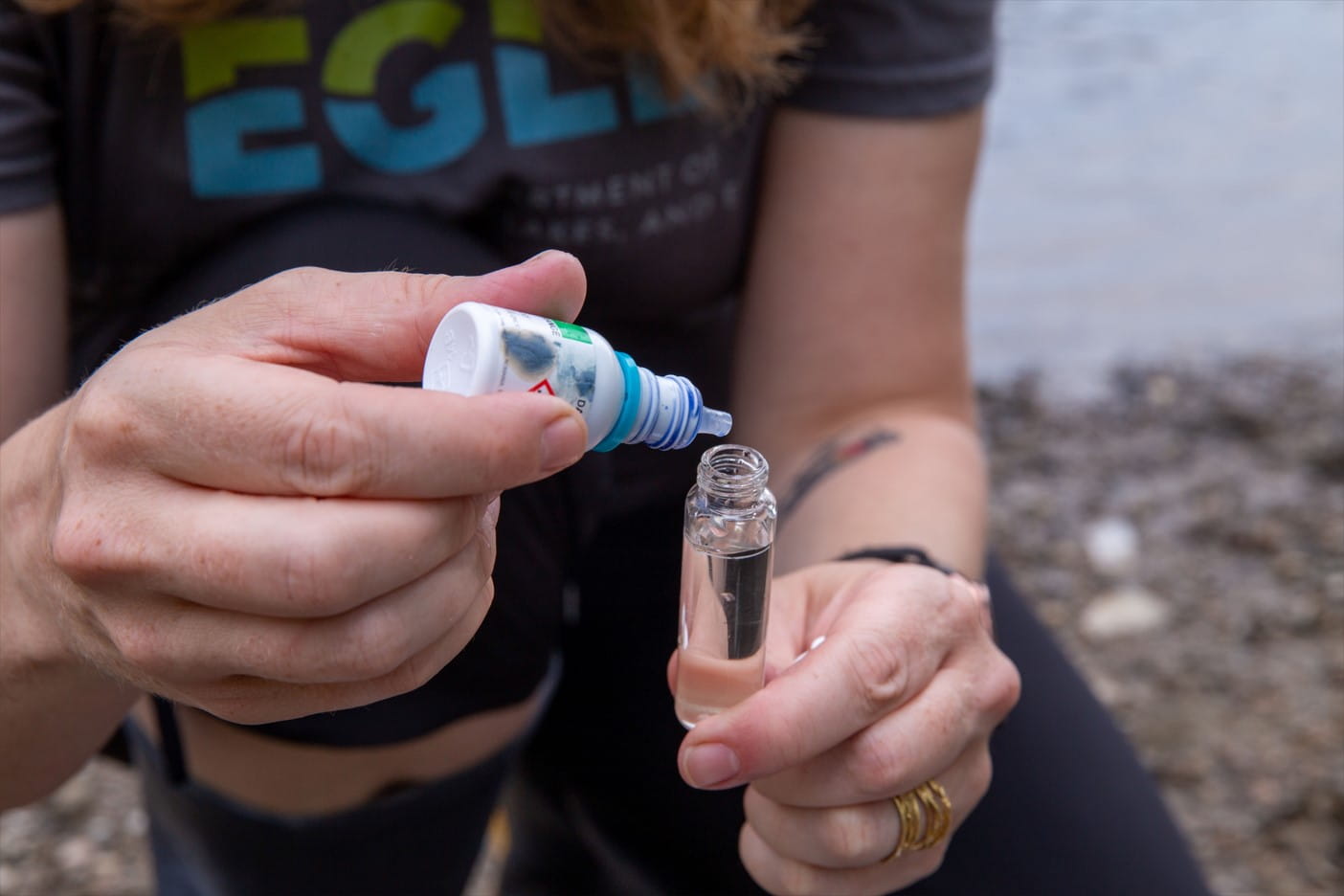Eileen Boekestein, environmental education manager with the Michigan Department of Environment, Great Lakes, and Energy (EGLE), demonstrates water quality tests in the H20 Q Kit backpack educators can check out from EGLE’s environmental lending station.
