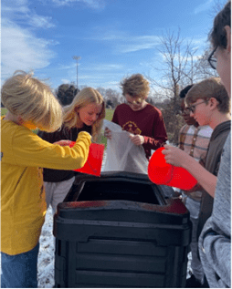 Upton Middle School students prepare materials for composting in St. Joseph, Mich.