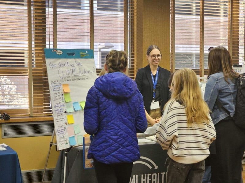 Julia Field, deputy climate and energy advisor with EGLE’s Office of Climate and Energy, greets students at Michigan’s first Earth Day Student Summit in Lansing in April 2024.