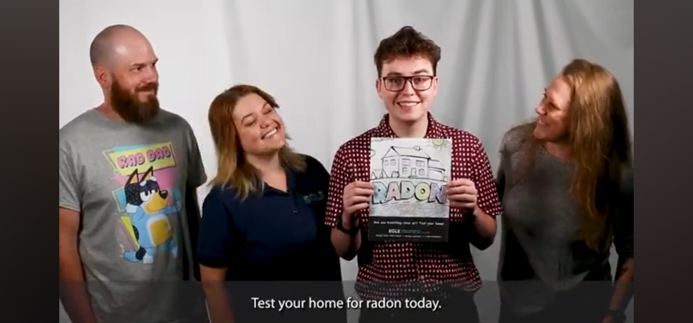 EGLE staffers Jay Paquette, Katrina Robinson, Ben Lowen and Eileen Boekestein (l to r) in parody music video with caption saying "Test your home for radon today."
