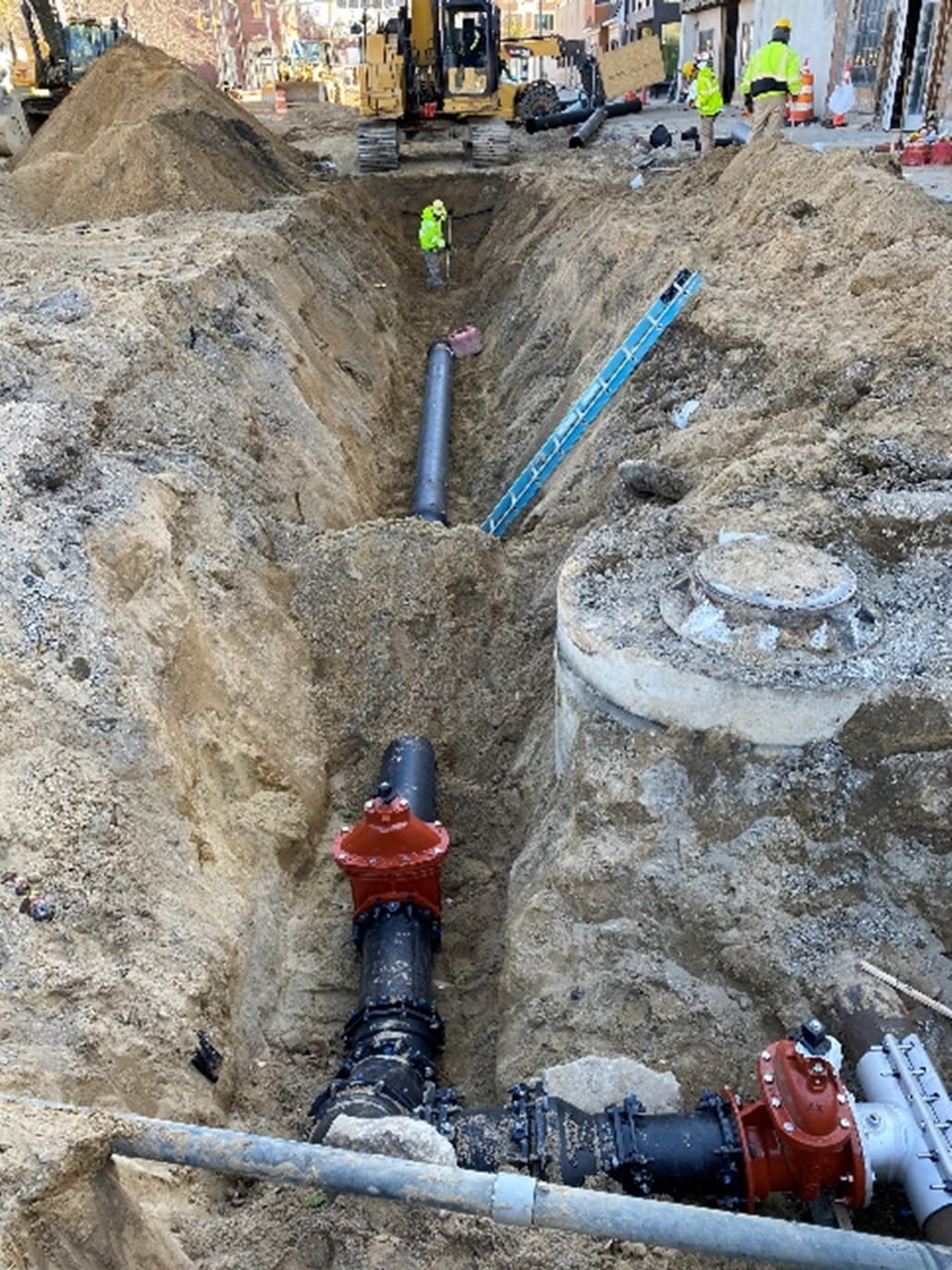Drinking Water State Revolving Fund project showing workers upgrading underground water infrastructure.  