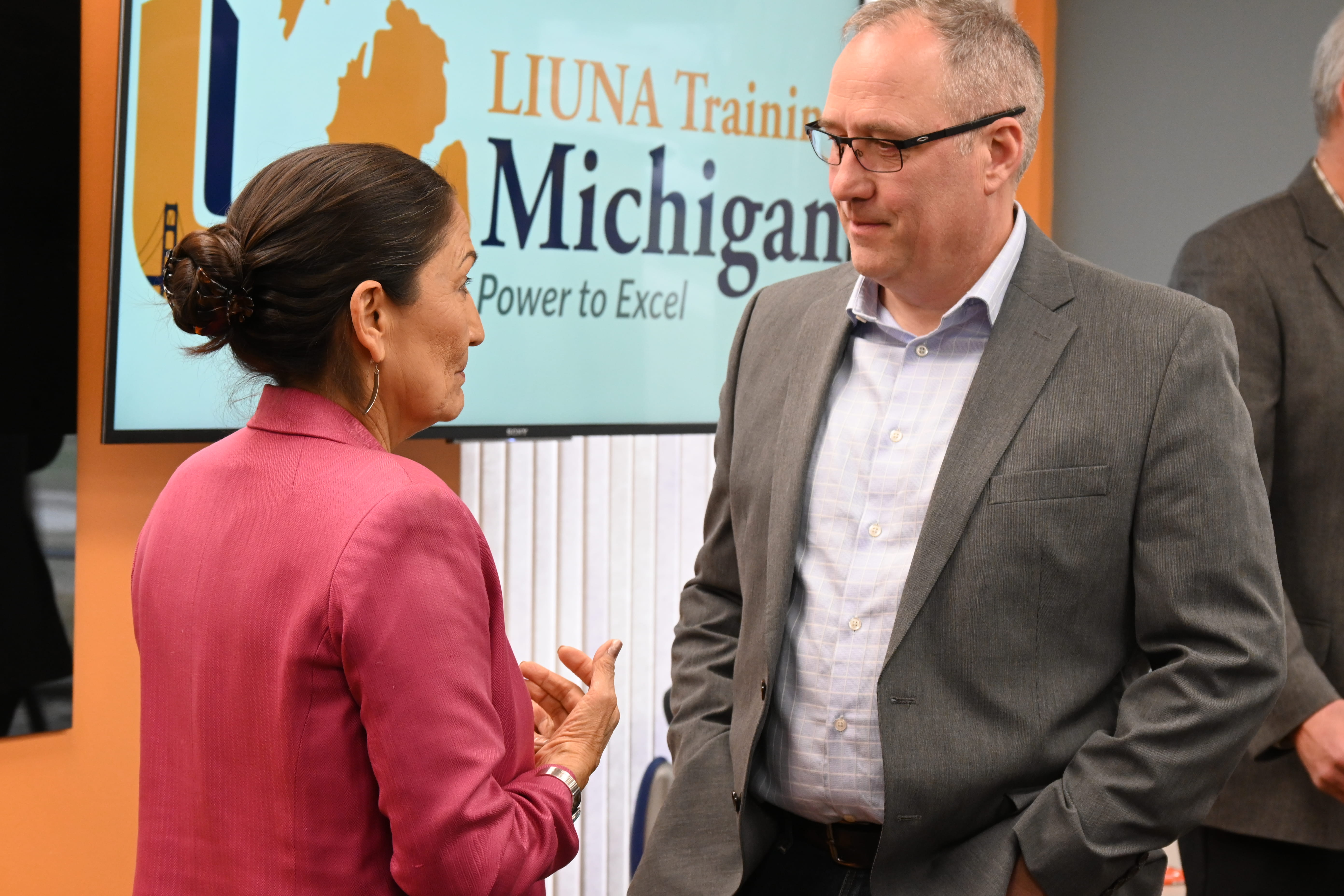 Adam Wygant, director of EGLE's Oil, Gas, and Minerals Division, talks with Deb Haaland, U.S. Department of Interior Secretary, at a legacy pollution roundtable discussion in Wayne, MI.