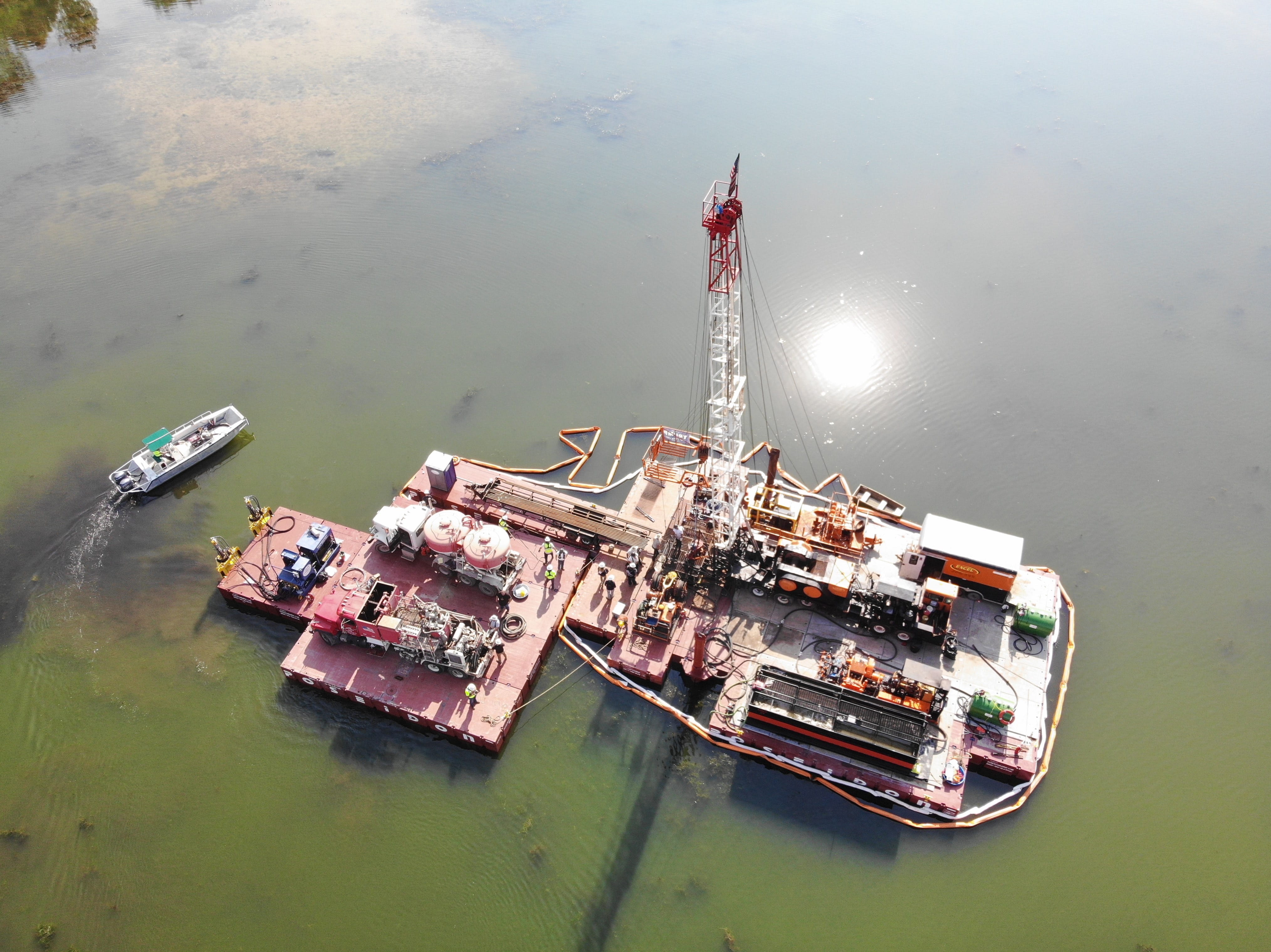 A barge-mounted drilling rig seals the orphaned Van Single 1 and 2 wells.