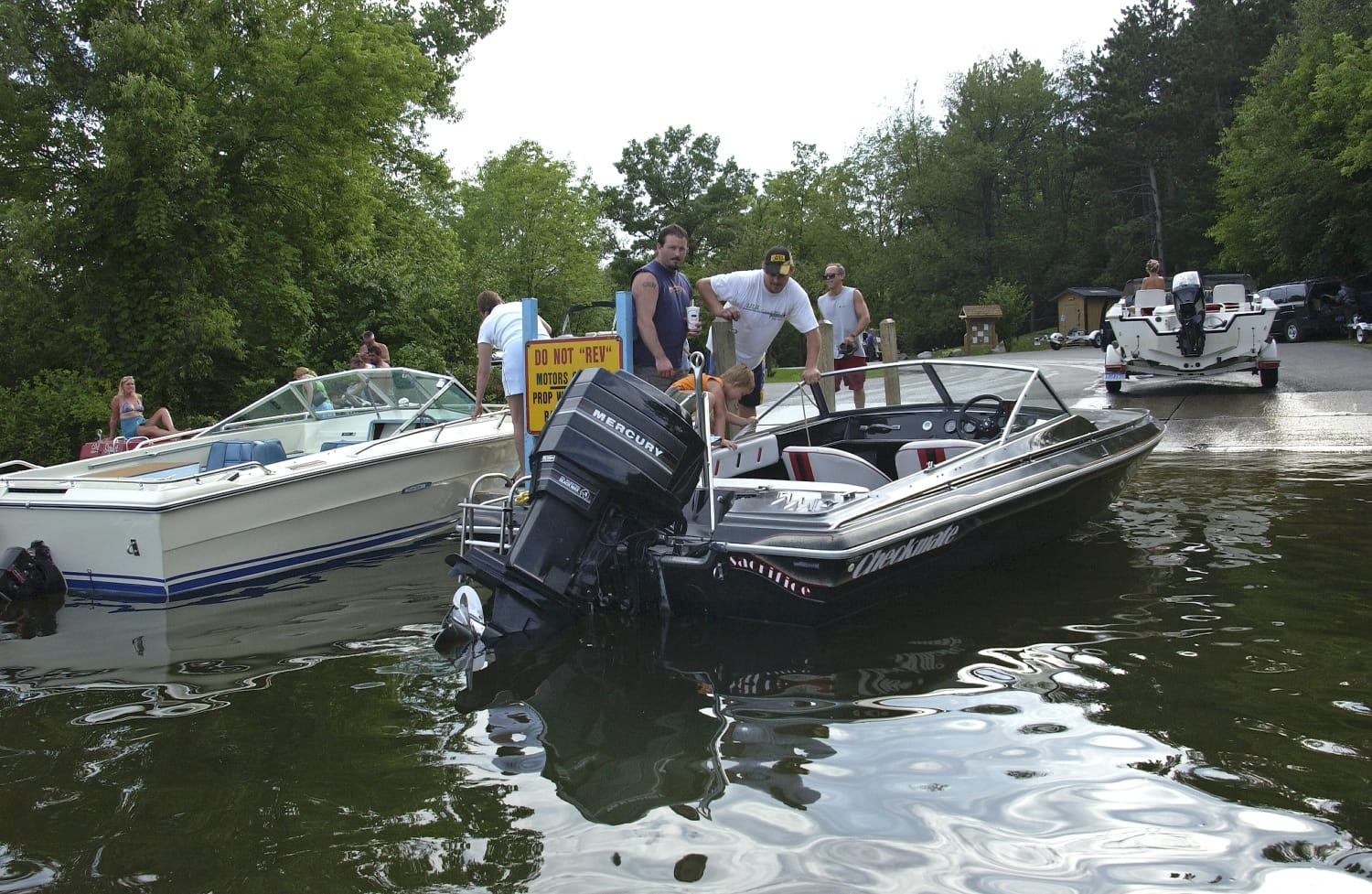 Boats in water at boat launch.