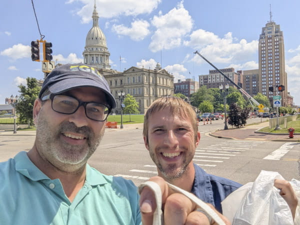 Bryan Grochowski and Nathan Noll on their litter cleanup around the Capitol building in Lansing in July.