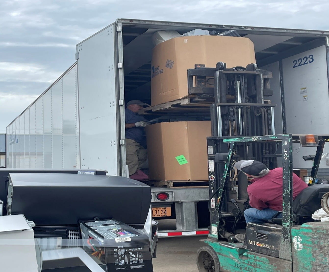 Worker loads collected electronics for recycling onto a truck in Gladstone. 