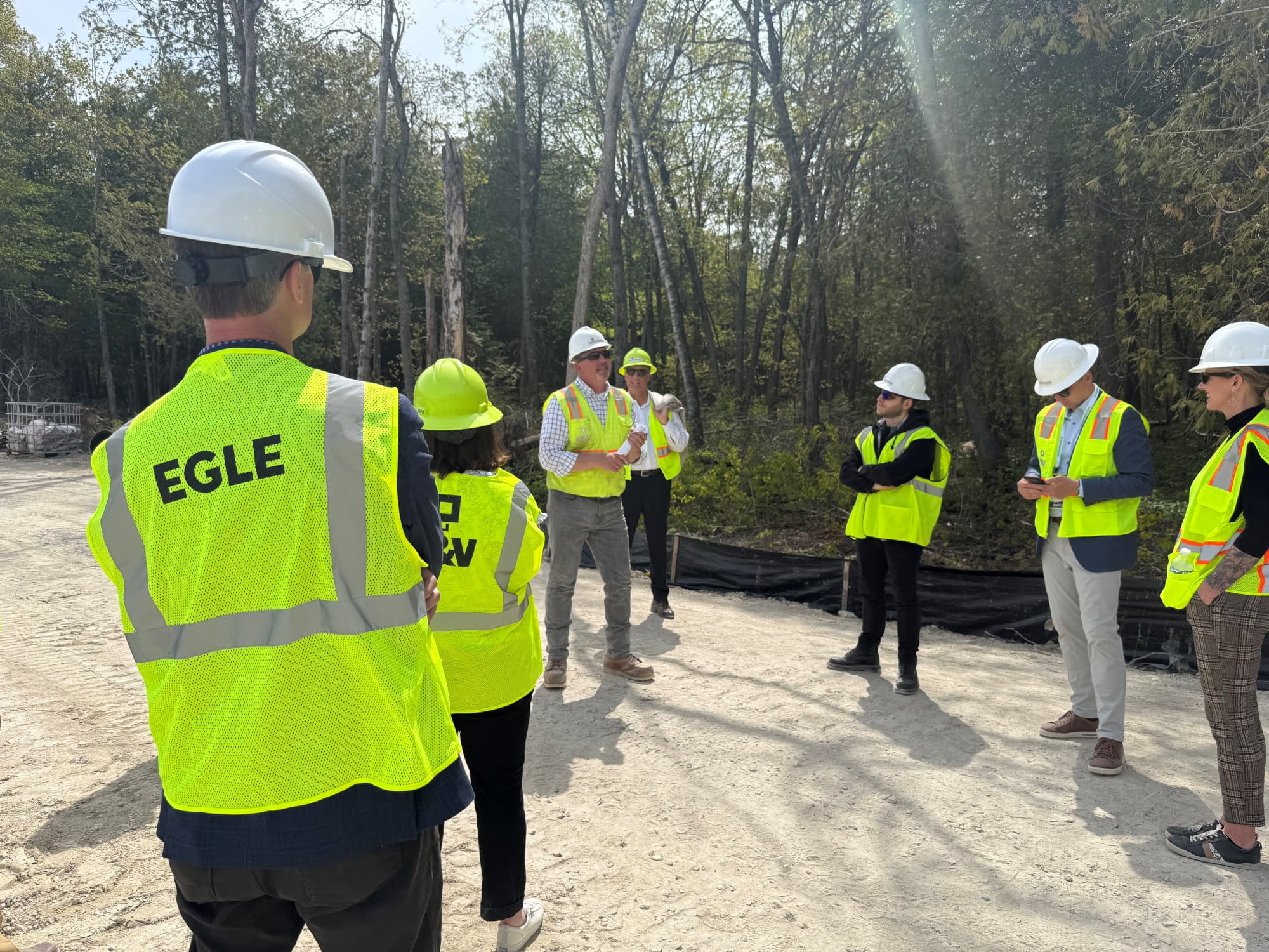 EGLE Director Phil Roos (l) and others tour the wastewater treatment plant on Mackinac Island.