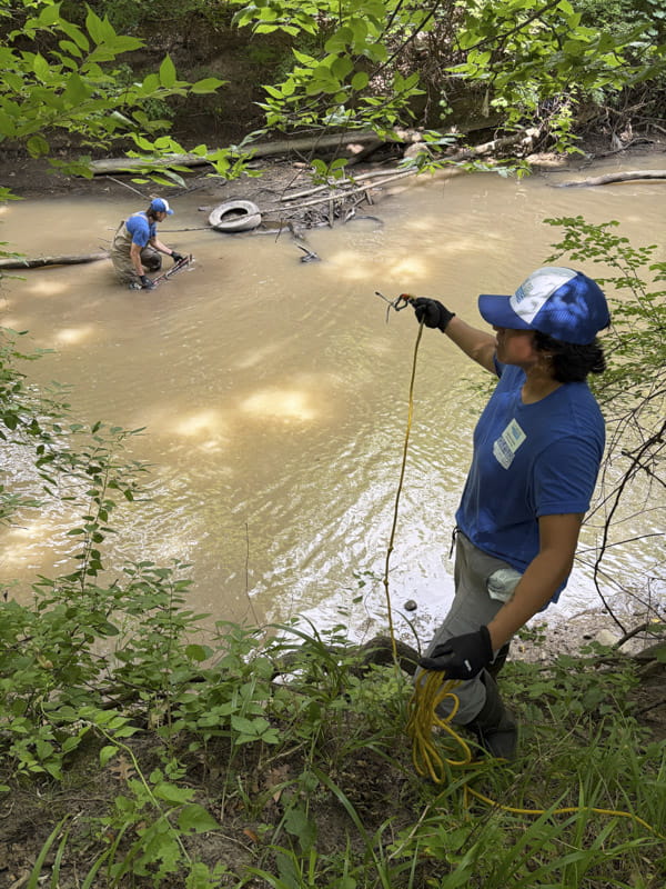 Two people at Plaster Creek cleanup. Credit: Damaris Potter.