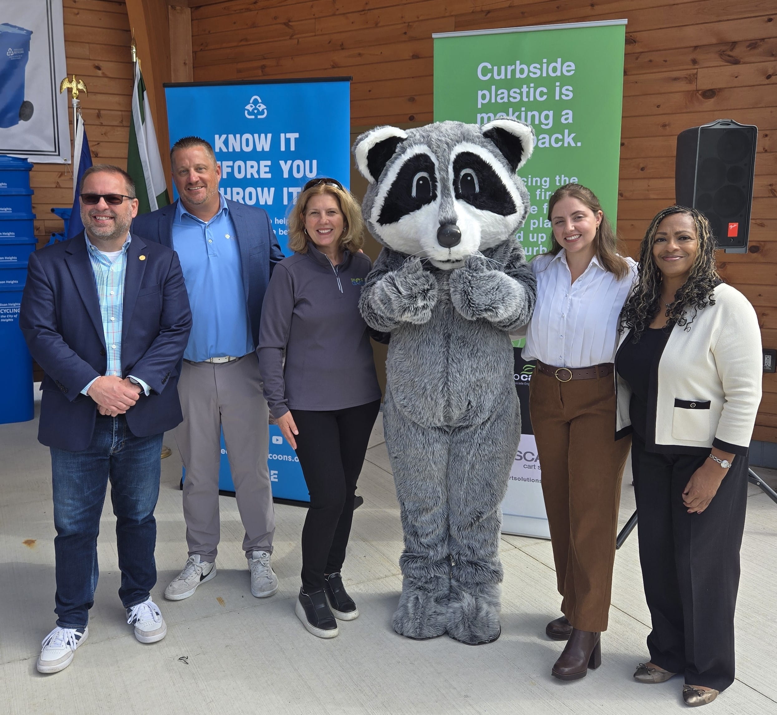 EGLE staffers join officials with the City of Madison Heights and Cascade Engineering and the Recycling Raccoons mascot at a recycling event in Madison Heights. 