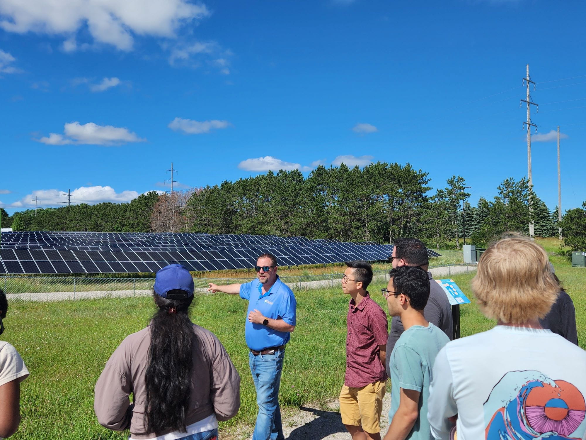 Members of the 2024 Catalyst Leadership Circle Fellows meet with Traverse City Light and Power's Jacob Hardy. Courtesy of Graham Sustainability Institute.