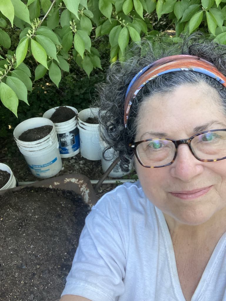 Judy Putnam, of East Lansing, with buckets of compost.