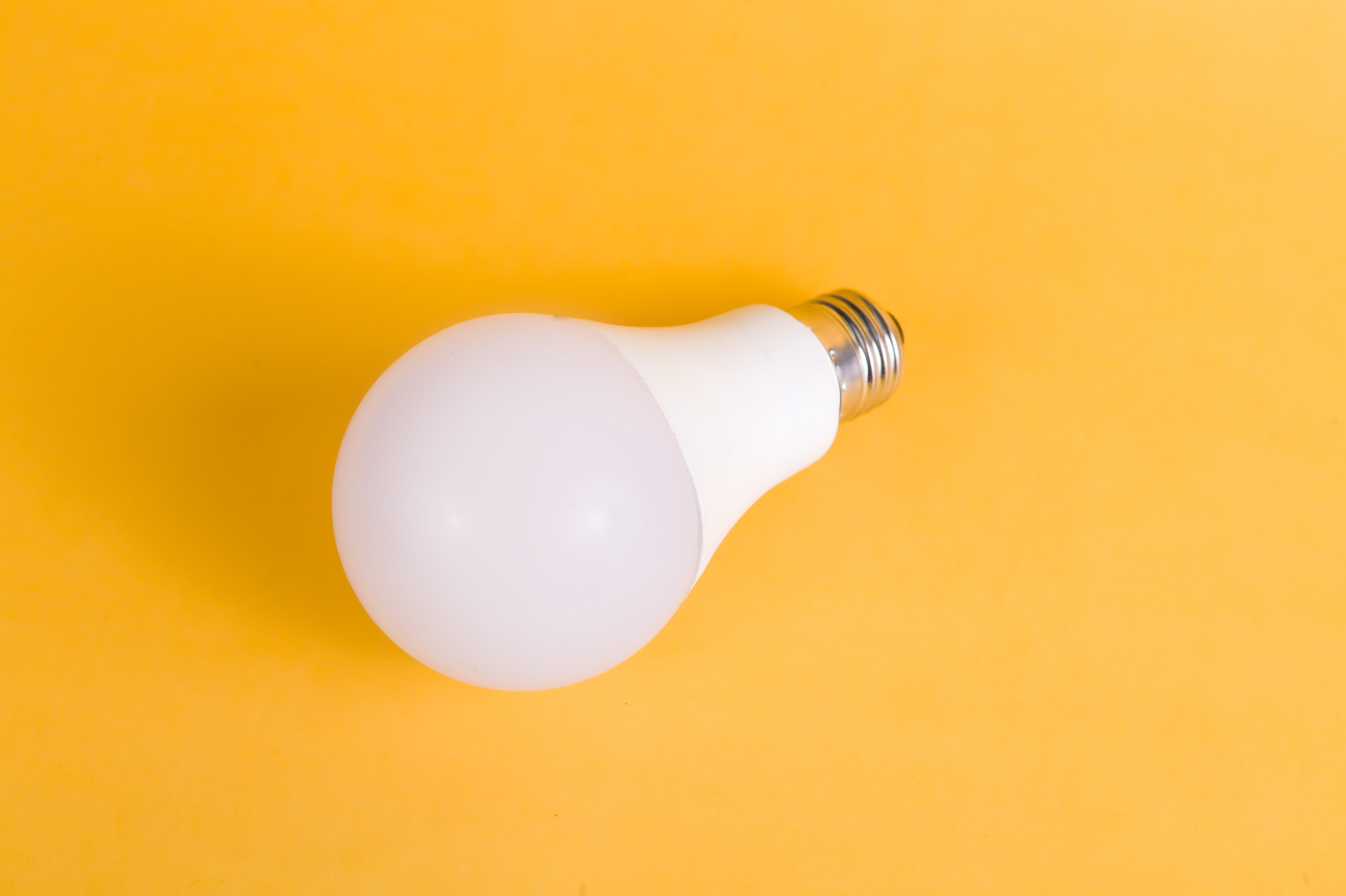 LED light bulb on yellow background. Photo from Pexels by Riki Risnandar