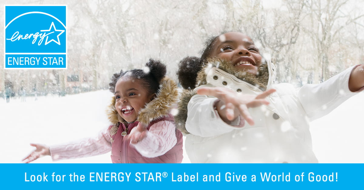 Two girls playing in the snow with text that reads “Look for the ENERGY STAR Label and Do a World of Good!”