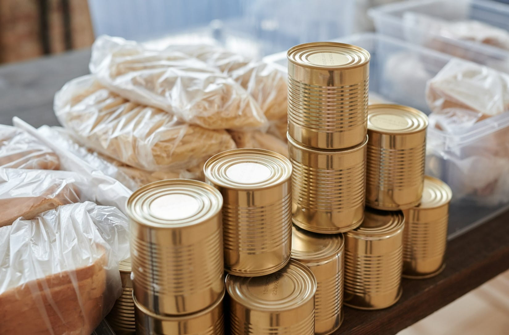 A stack of canned goods without labels.